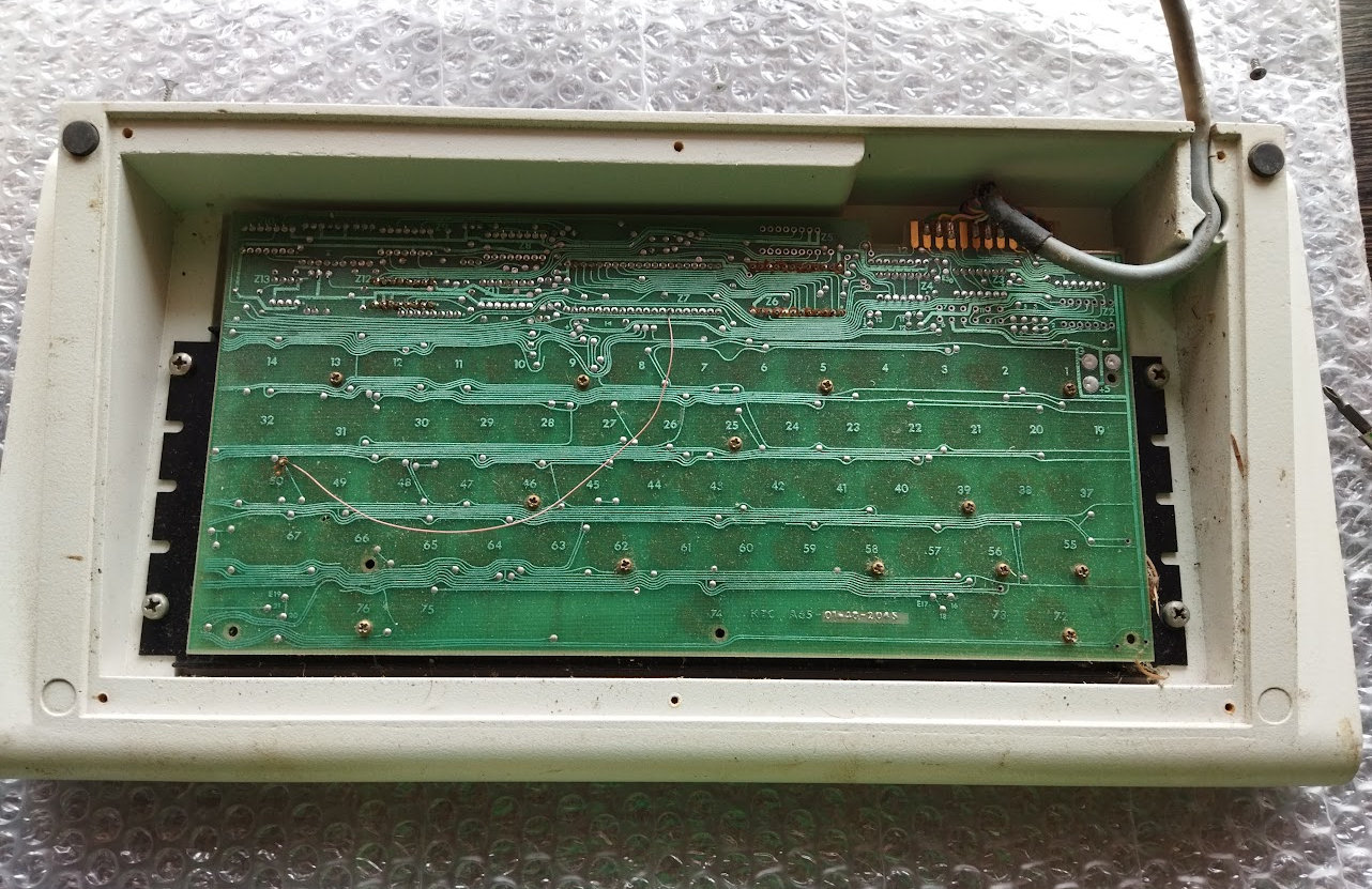 Pic: Case, plate, PCB, and a bridged trace from 40 years ago :D